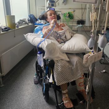 Rebecca sitting up, injured in hospital