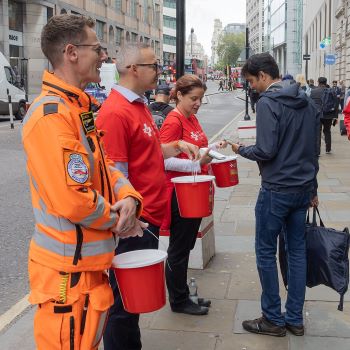 Crew and staff bucket collecting for London's Air Ambulance Charity