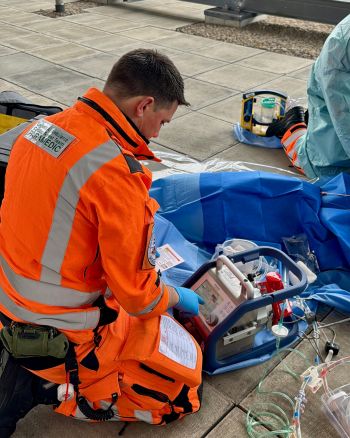 A medic using the ECMO machine