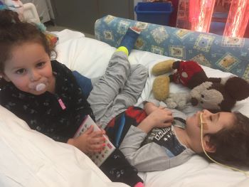 Joshua Hpff with his sister in hospital after London's Air Ambulance attended to him