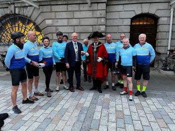 Lord Mayor waving off cyclist for London's Air Ambulance Charity