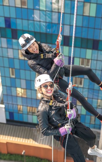 Katya Jones and Aimee Fuller doing London's Air Ambulance Charity's helipad abseil