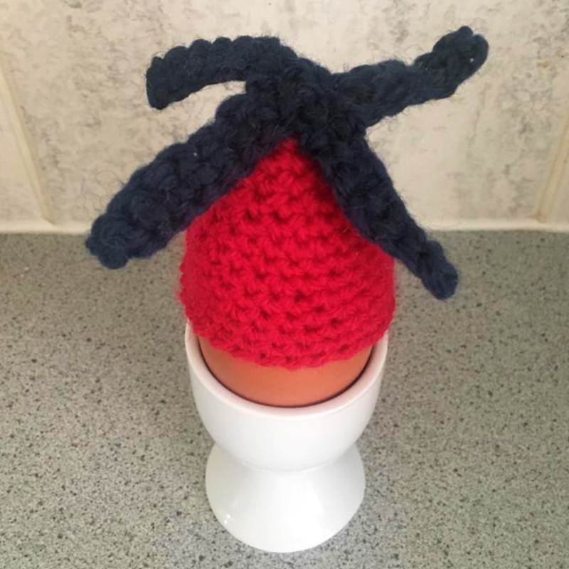 Egg with knitted helicopter on top