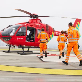Our crew running to our helicopter