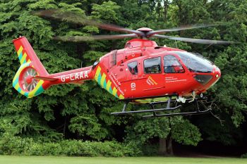 Our helicopter landing in a green space