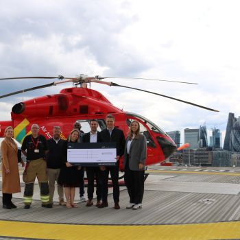 RED's team visiting our helipad, stood infront of the helicopter