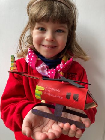 Rozi holding her finished helicopter