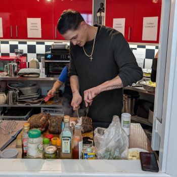 Jason cooking for his community