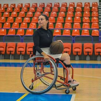 Cristiana playing wheelchair basketball