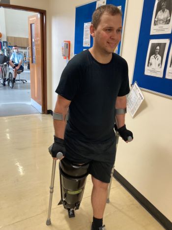 Zoltan learning to walk on a prosthetic