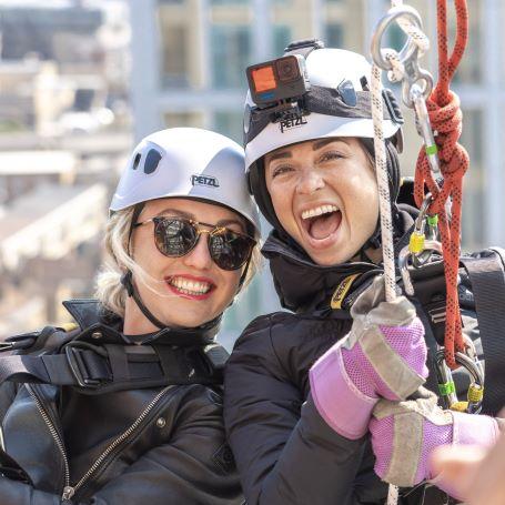 Katya Jones and Aimee Fuller doing London's Air Ambulance Charity's helipad abseil