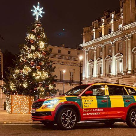 London's Air Ambulance rapid response car parked next to a decorated Christmas tree