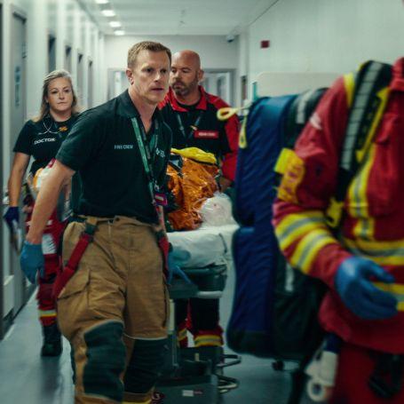Our expert team handing over a patient to a major trauma centre