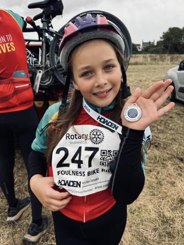 Violet with her cycling medal